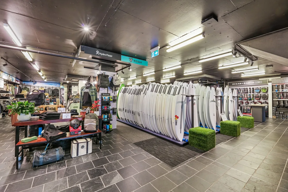 Surfboards lined up inside Triple Bull Surf & Skate in Cronulla